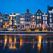 Evening light view over a canal at traditional Amsterdam buildings