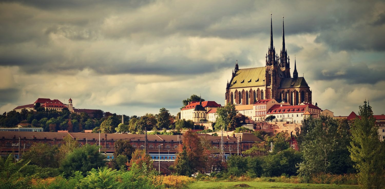 View of Brno skyline with a train going from Prague to Budapest in the foreground