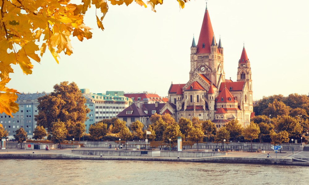 View over the river at the church Heiliger Franz of Assisi at Mexikoplatz, Vienna, Austria