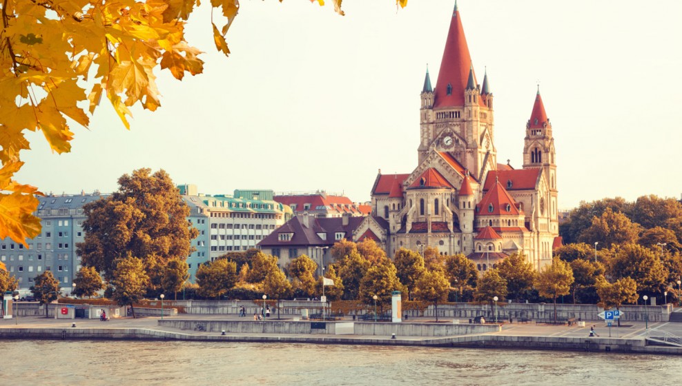 View over the river at the church Heiliger Franz of Assisi at Mexikoplatz, Vienna, Austria