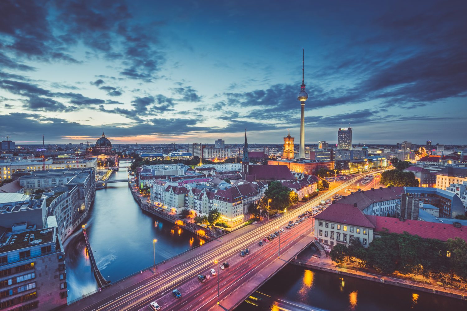 Berlin skyline at twilight with traffic lights in the foreground