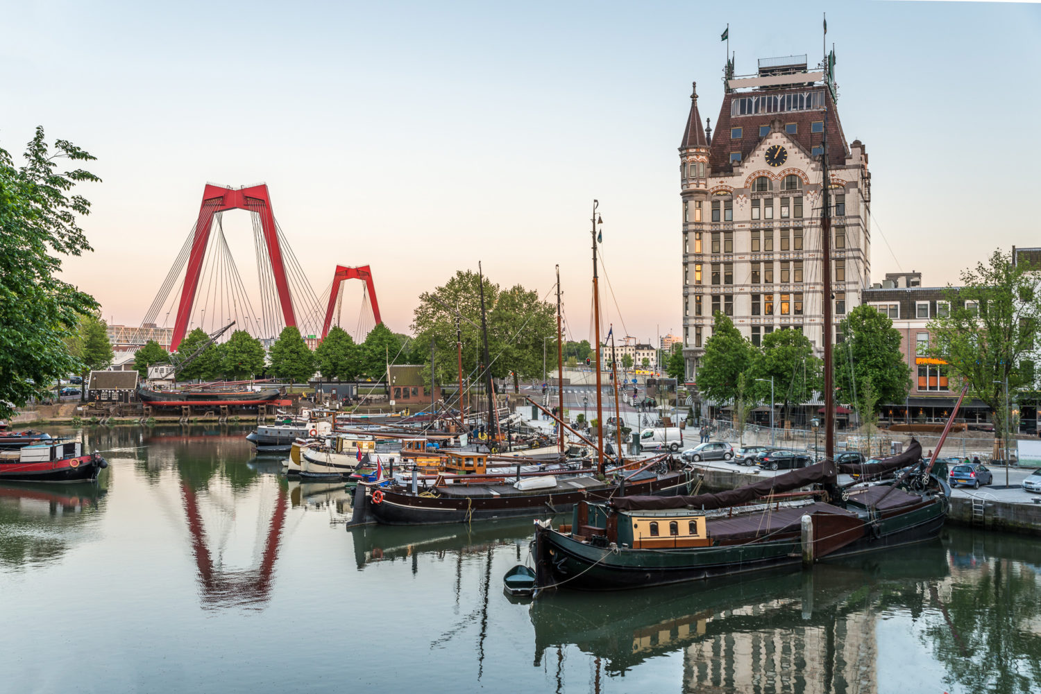 Old harbor of Rotterdam, Netherlands with Willemsbrug bridge in the background
